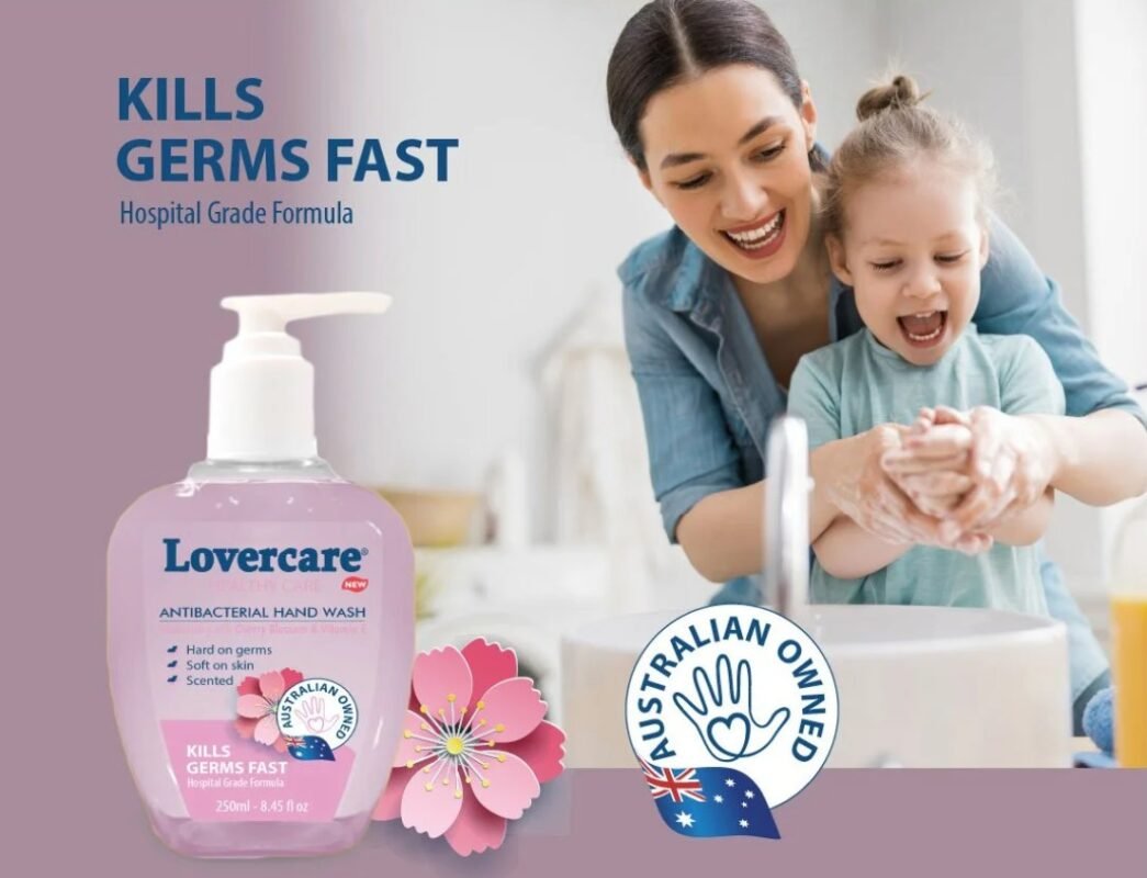 Lovecare antibacterial hand wash bottle beside a mother helping her daughter wash hands at a sink.